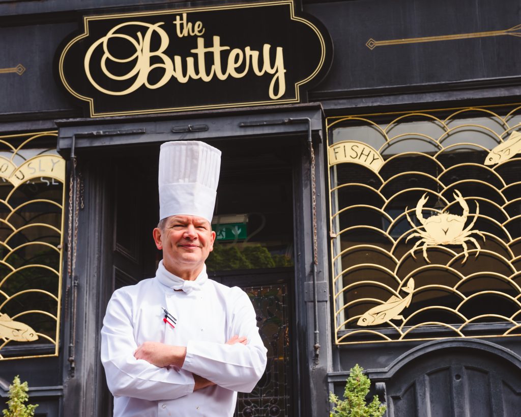 Chef Stephen Johnson standing outside The Buttery Glasgow