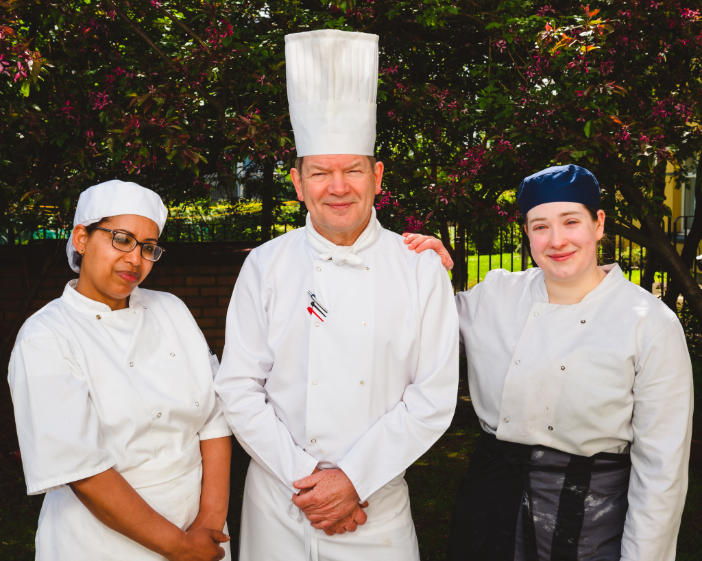 Chef Stephen Johnson and two team members outside The Buttery Glasgow
