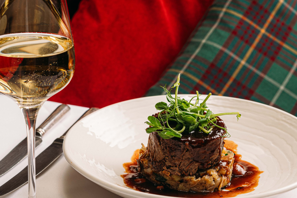 scottish shin of beef with a glass of white wine.